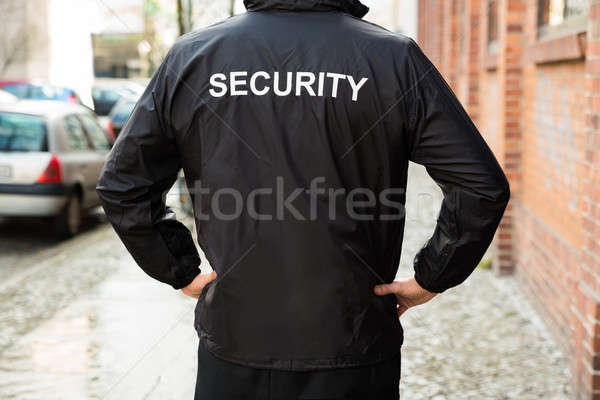 Biztonsági őr visel kabát közelkép férfi fekete Stock fotó © AndreyPopov