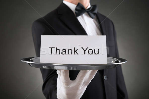 Waiter Holding Plate With The Text Thank You On Paper Stock photo © AndreyPopov