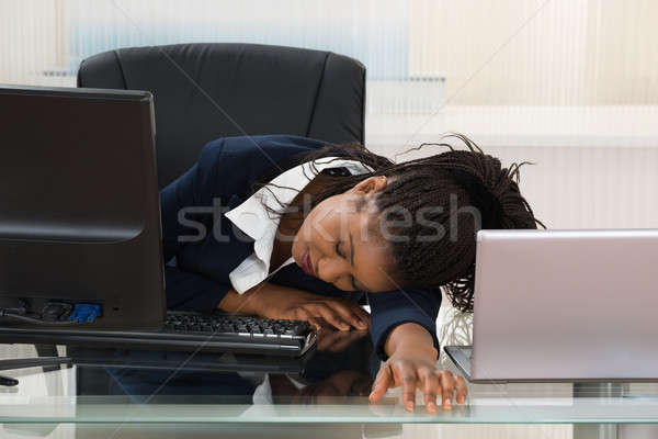 Businesswoman Sleeping On Desk Stock photo © AndreyPopov