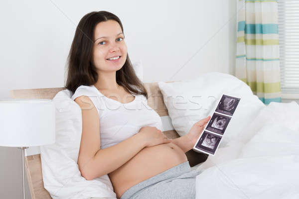 Femme enceinte ultrasons image bébé heureux [[stock_photo]] © AndreyPopov