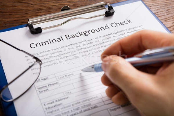 Person Filling Criminal Background Check Application Form Stock photo © AndreyPopov