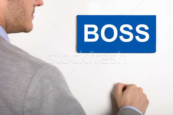 Businessman Knocking Door With Boss Text Stock photo © AndreyPopov