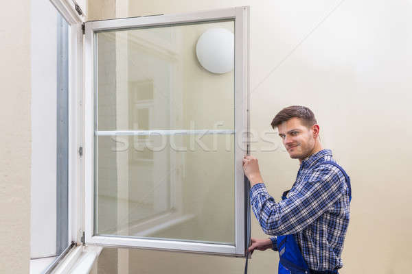 Repairman Fixing Window Stock photo © AndreyPopov