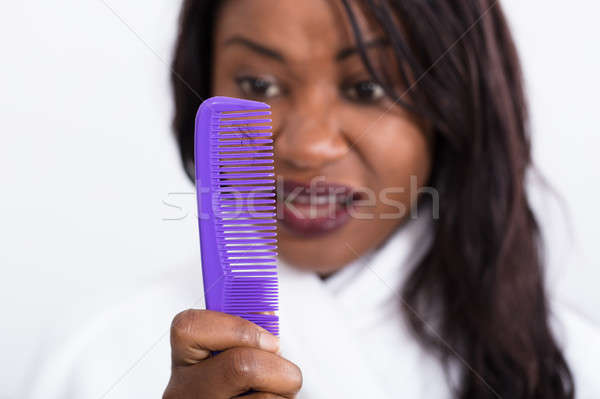 Nő néz veszteség haj tart fésű Stock fotó © AndreyPopov