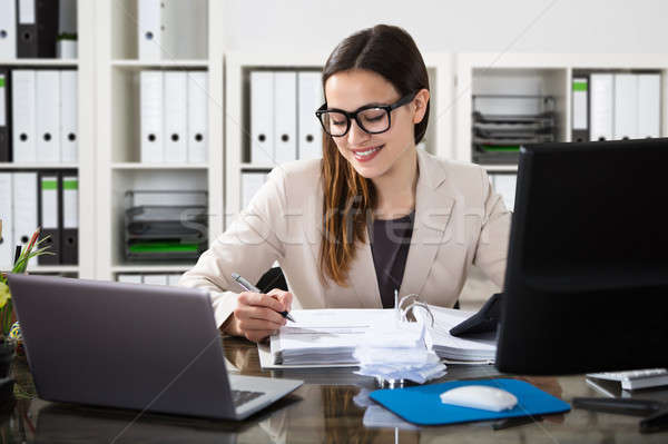 Happy Businesswoman Using Calculator Stock photo © AndreyPopov