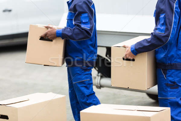 Two Men Holding The Cardboard Boxes Stock photo © AndreyPopov