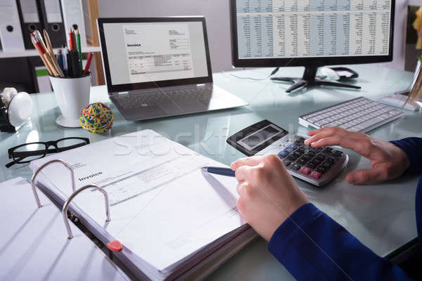 Businessperson Calculating Invoice Stock photo © AndreyPopov
