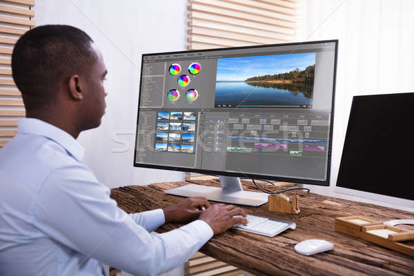 Businessman Editing The Video On Computer Stock photo © AndreyPopov