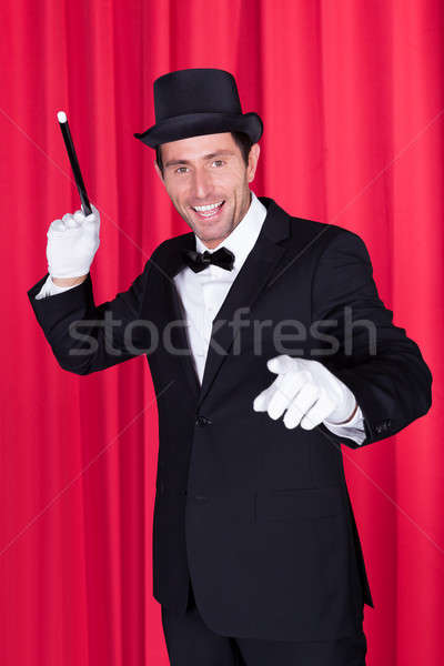 A Magician In A Black Suit Stock photo © AndreyPopov