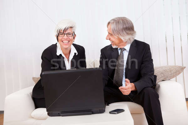 Business partners working on a laptop Stock photo © AndreyPopov