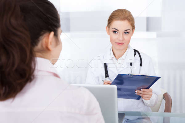 Female Doctor Talking With Patient Stock photo © AndreyPopov
