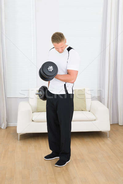 Muscular Man Lifting Weights Stock photo © AndreyPopov