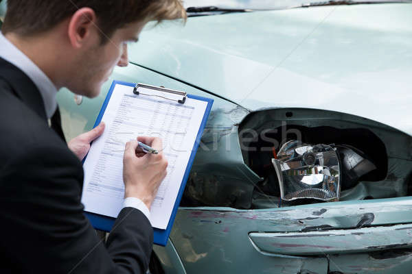 Assurance agent voiture accident vue de côté [[stock_photo]] © AndreyPopov