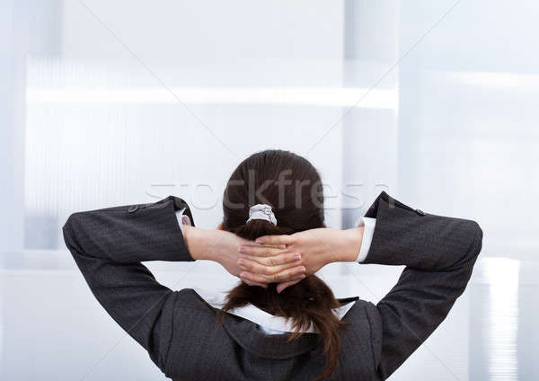 Businesswoman With Hands Behind Head Stock photo © AndreyPopov