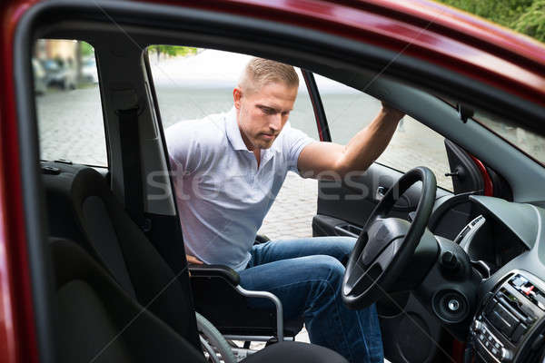 [[stock_photo]]: Handicapées · homme · embarquement · voiture · séance · fauteuil · roulant