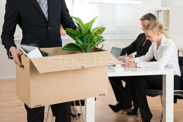 Businessman Carrying Personal Belongings Stock photo © AndreyPopov