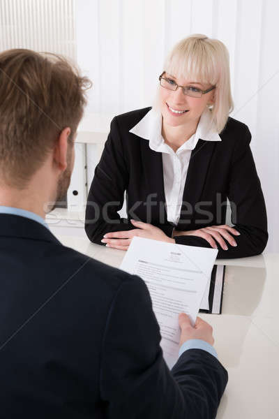 Stock photo: Male Manager Interviewing A Female Applicant