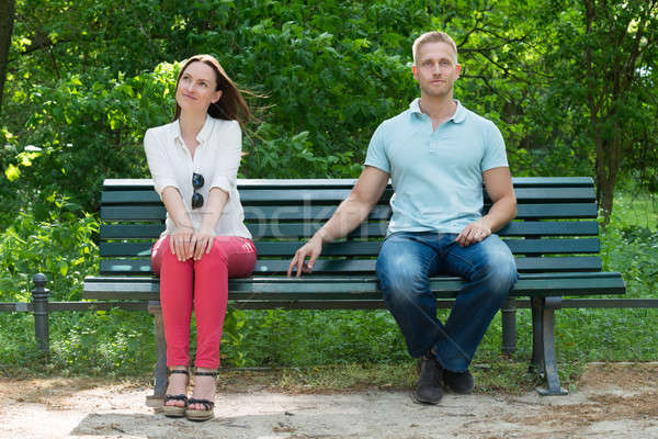 Shy Man Flirting With Woman On Bench Stock photo © AndreyPopov
