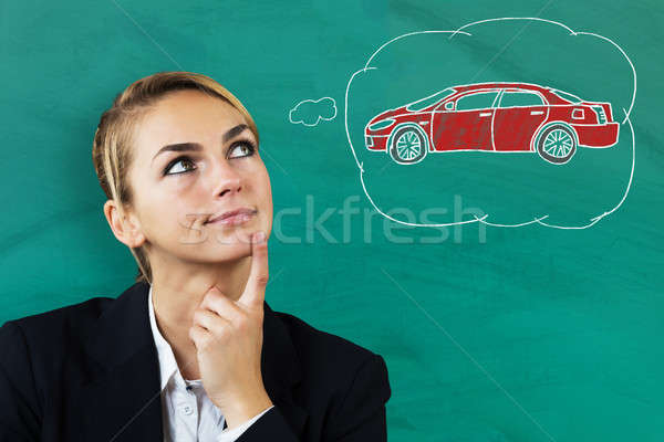 Mujer de negocios pensando comprar coche jóvenes hermosa Foto stock © AndreyPopov