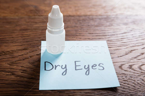 Dry Eyes Concept On Wooden Desk Stock photo © AndreyPopov