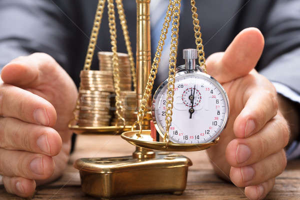 Geschäftsmann Stoppuhr Münzen Maßstab golden Holztisch Stock foto © AndreyPopov