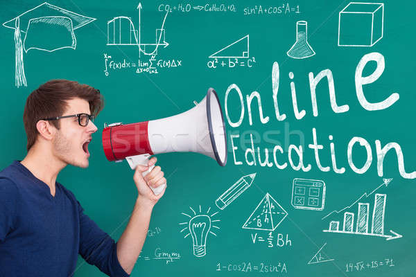 Teacher Announcing Online Education Through Megaphone Stock photo © AndreyPopov