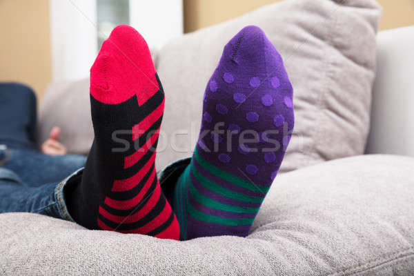 Humaine pieds chaussettes pointillé rayé Photo stock © AndreyPopov