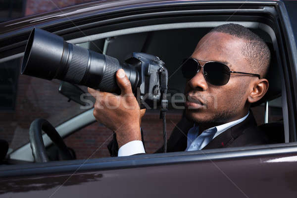 Nyomozó ül bent autó fényképezés kéz Stock fotó © AndreyPopov