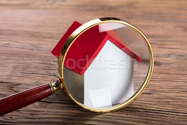 Magnifying Glass And Green Paper House Stock photo © AndreyPopov