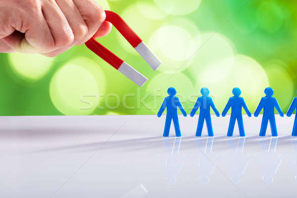 Businessman Attracting Human Figures With Horseshoe Magnet Stock photo © AndreyPopov