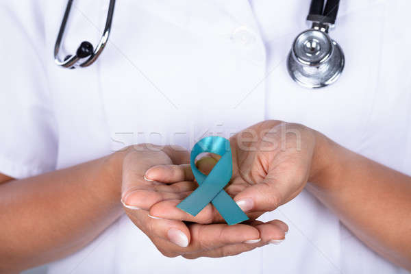 Doctor With Teal Ribbon Showing Ovarian Cancer Awareness Stock photo © AndreyPopov