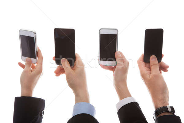 Close Up Of Human Hand Holding Cell Phone Stock photo © AndreyPopov