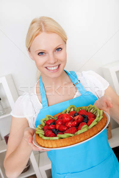 Beautiful young woman holding cake Stock photo © AndreyPopov