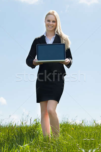 Portátil feliz jóvenes mujer de negocios Foto stock © AndreyPopov