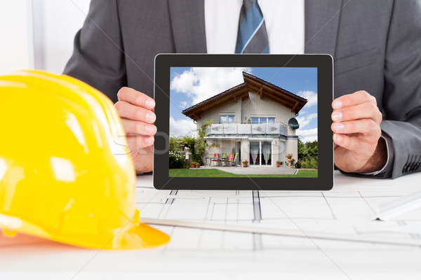 Architect Holding Digital Tablet Stock photo © AndreyPopov