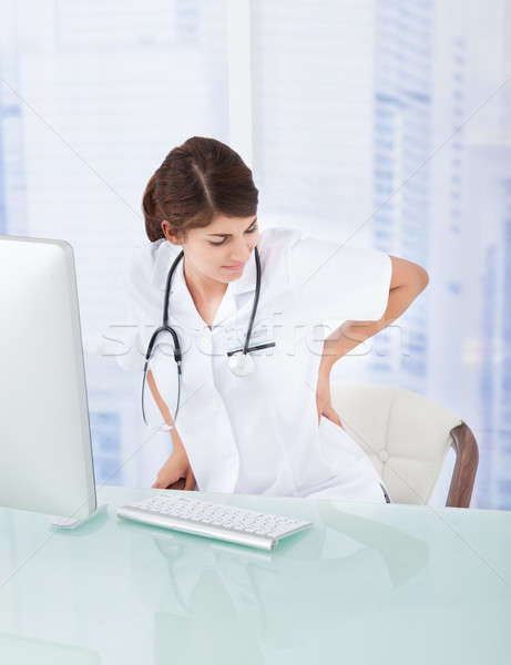 Médecin mal de dos ordinateur bureau triste Homme [[stock_photo]] © AndreyPopov