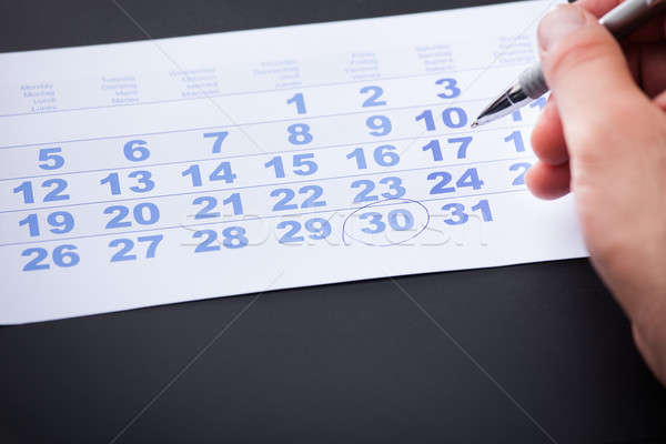 Businessman Marking On Calendar Stock photo © AndreyPopov