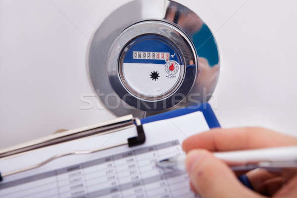 Hand Writing Water Consumption Level Stock photo © AndreyPopov