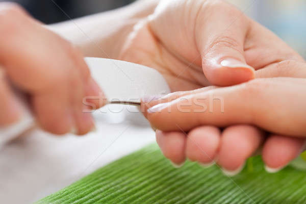 Beautician Filing Nails Of Woman Stock photo © AndreyPopov