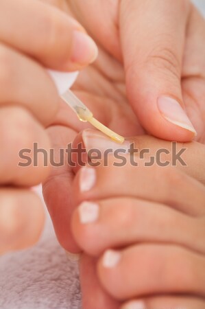 Beautician Applying Nail Varnish To Woman Stock photo © AndreyPopov
