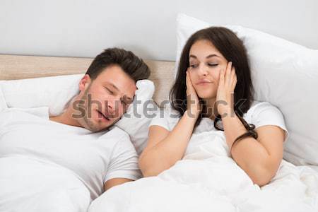 Unhappy Couple On Bed Stock photo © AndreyPopov