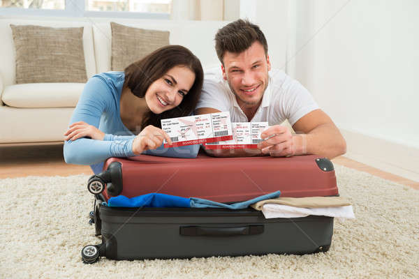 Happy Young Couple Showing Boarding Pass Stock photo © AndreyPopov