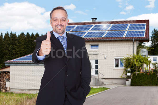 Geschäftsmann Haus glücklich stehen Sonne Stock foto © AndreyPopov