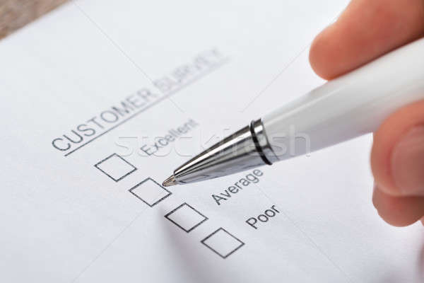 Person Hands Filling Customer Survey Form Stock photo © AndreyPopov