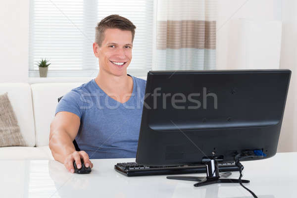 Man Using Desktop Computer Stock photo © AndreyPopov