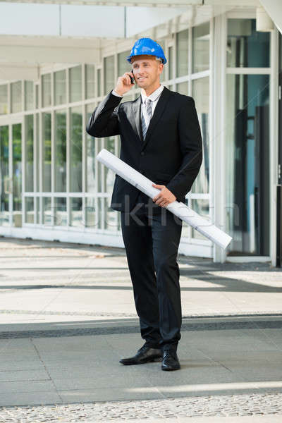 Engineer With Blue Print Talking On Cellphone Stock photo © AndreyPopov