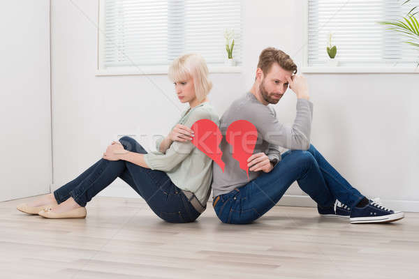 Sad Couple Holding Red Broken Heart Stock photo © AndreyPopov