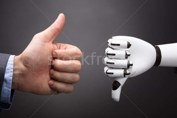 商人 機器人 顯示 拇指 上 下 商業照片 © AndreyPopov