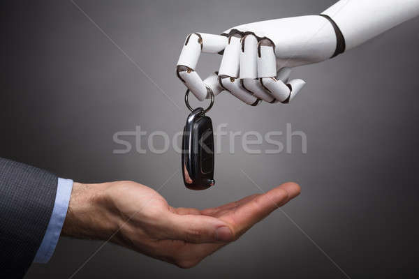 Robot Giving Car Key To Businessperson Stock photo © AndreyPopov