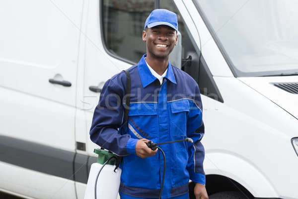 Zdjęcia stock: Młodych · uśmiechnięty · mężczyzna · pracownika · portret · stałego